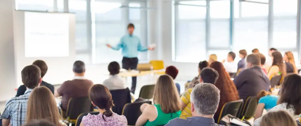 A professional training session with an audience and presenter